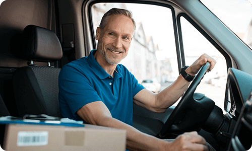 delivery driver smiling out truck window